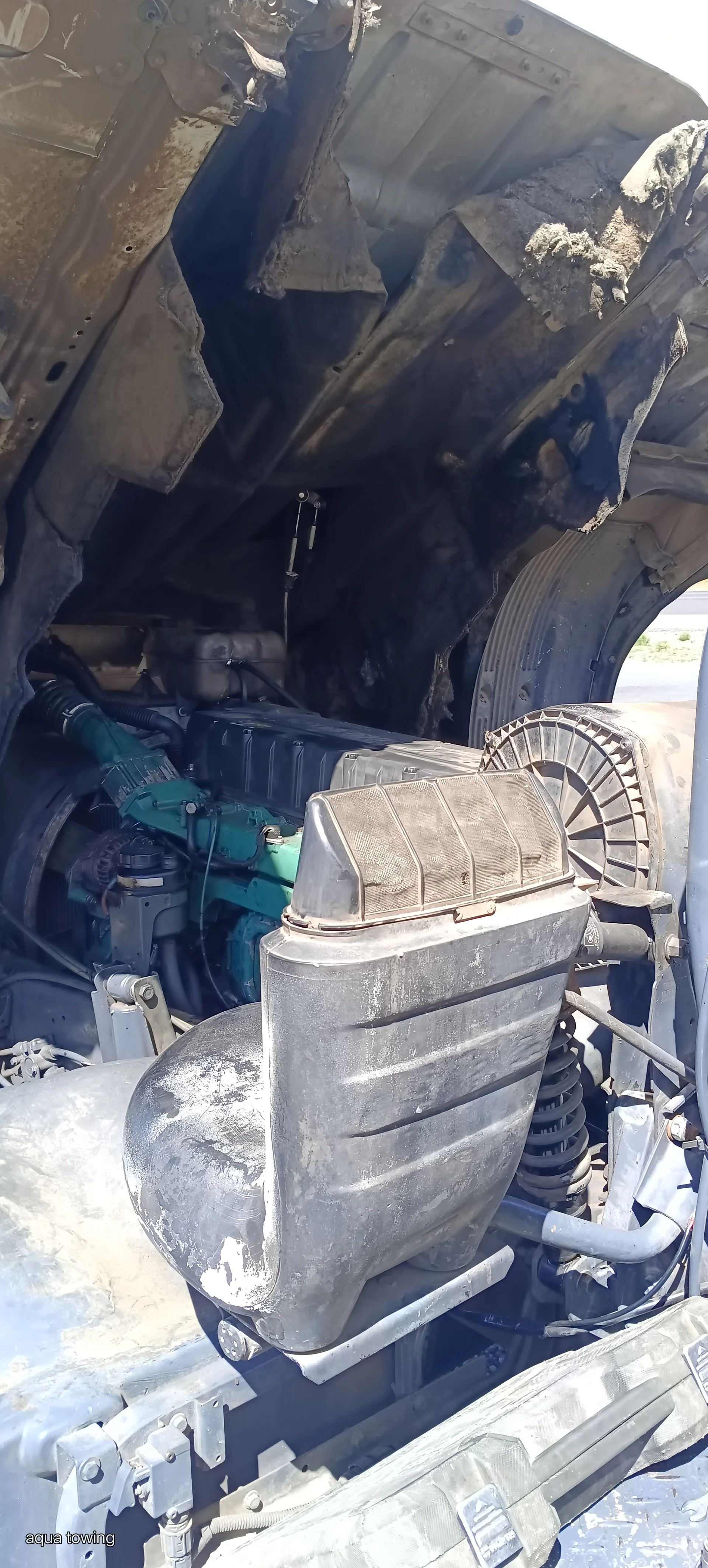 Flat tyre being changed on a car at the roadside